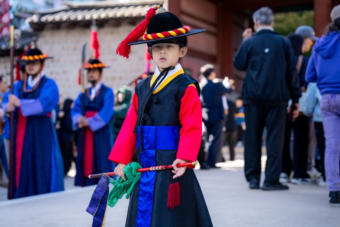 Performers in traditional Korean dress at a heritage parade