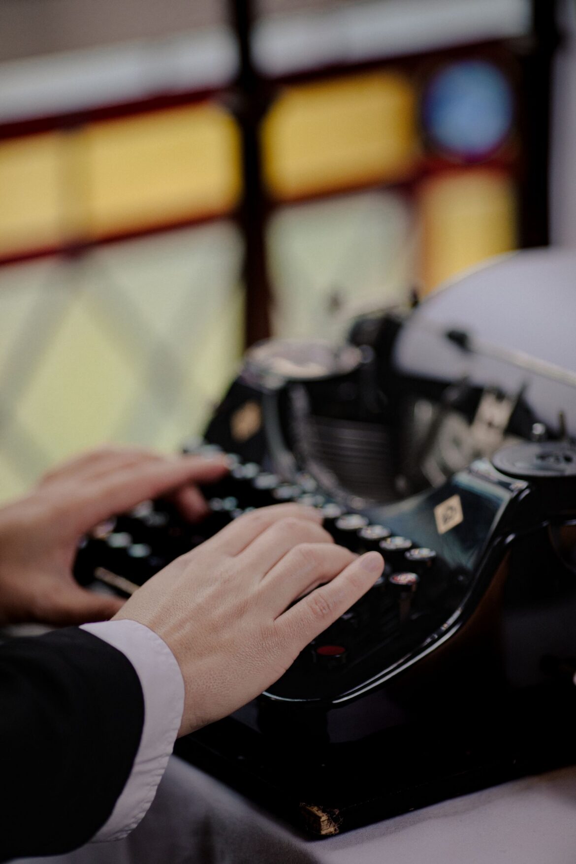 Close-up of someone writing, representing web novel writers