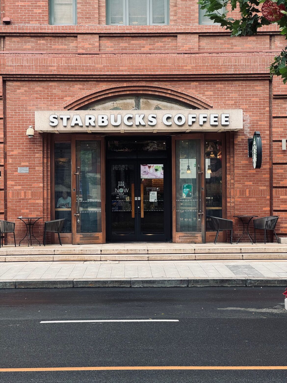 Exterior of a coffee shop with brick facade