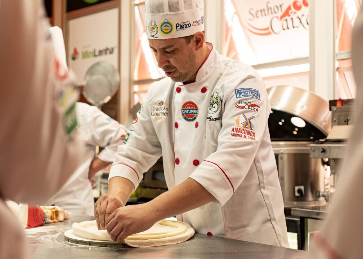 A chef cooking in a kitchen competition