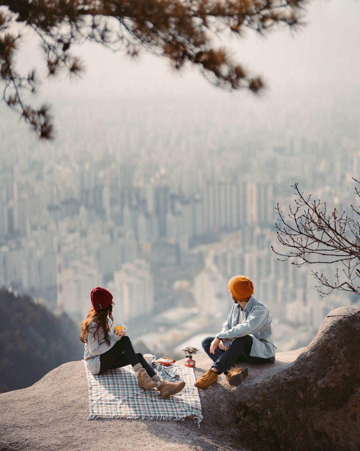 Couple enjoying a scenic picnic with breathtaking view of the Seoul skyline