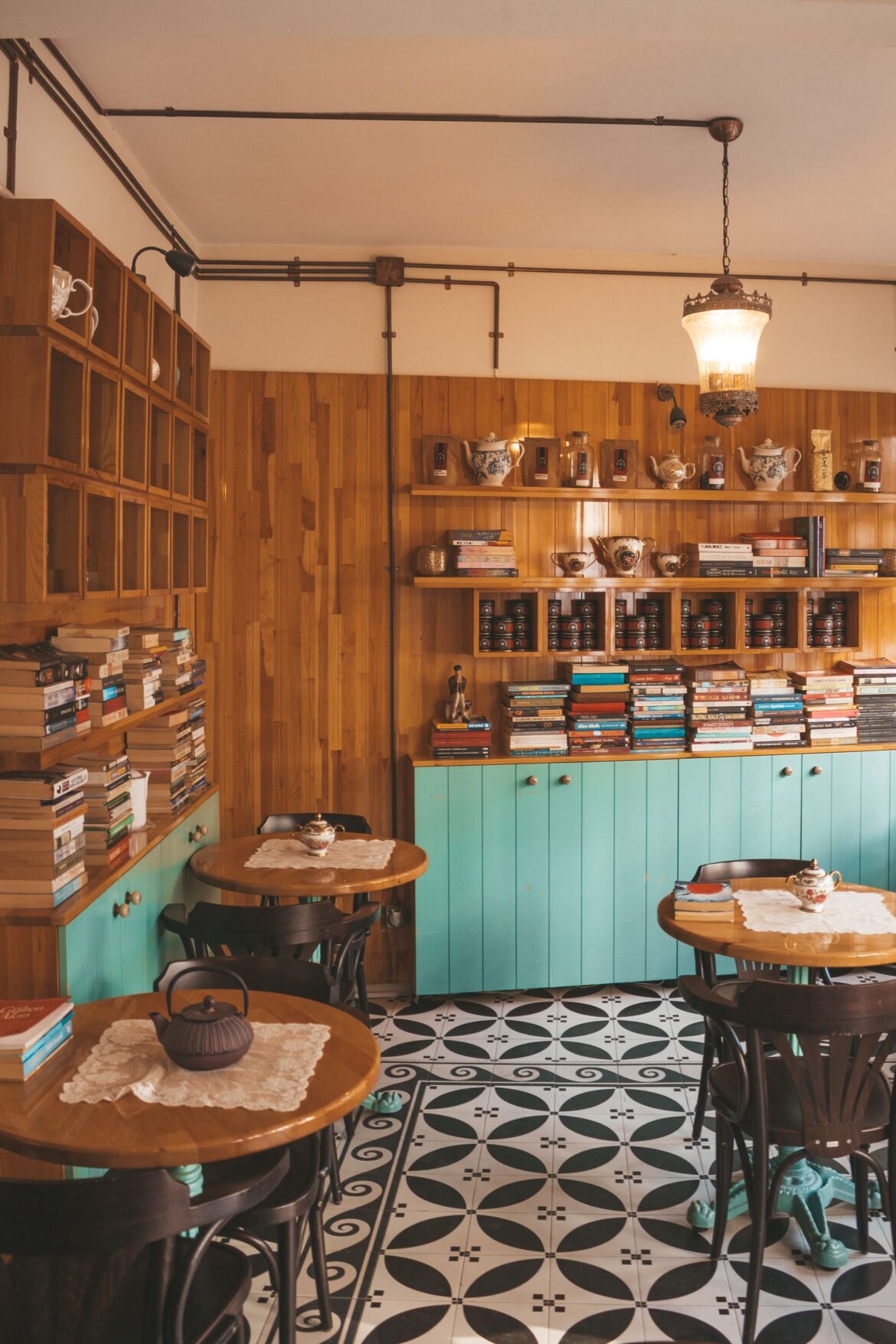Warm and inviting coffee shop with books wooden walls and vintage decor
