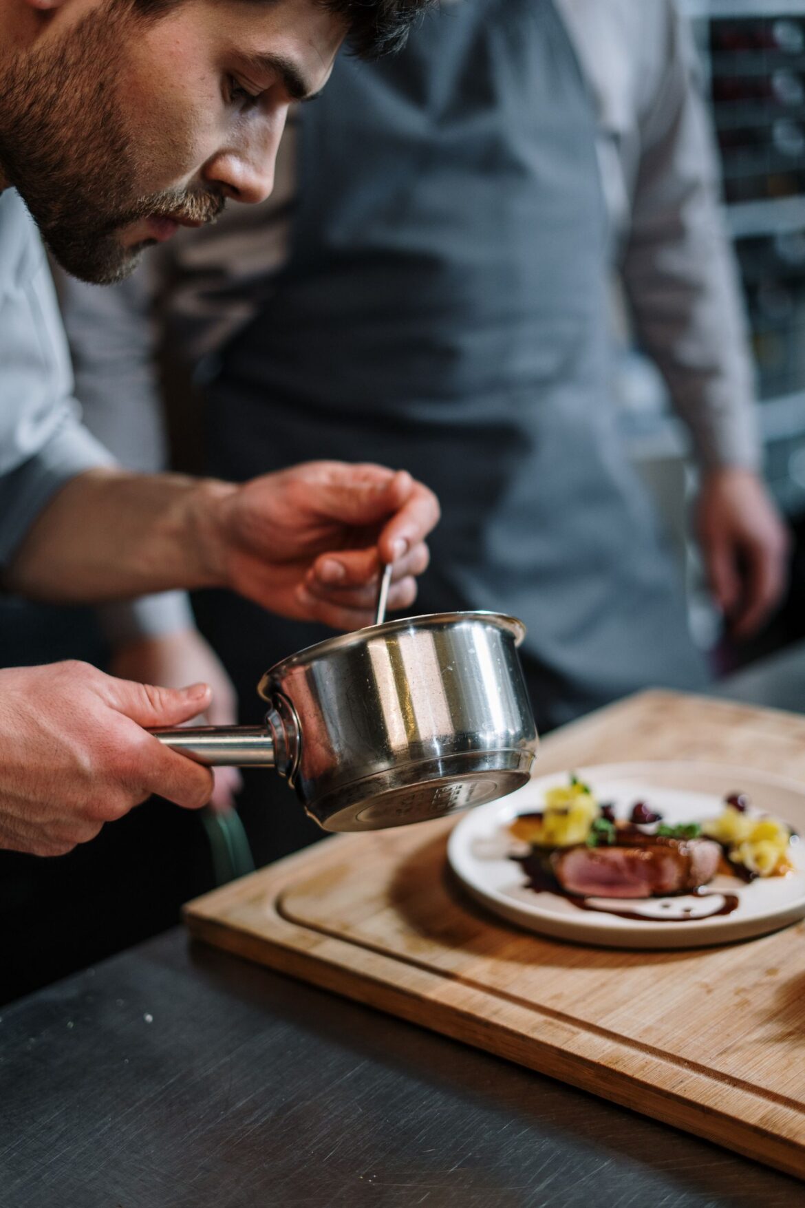 A professional chef cooking, representing Netflix Culinary Class Wars season 3 restaurant team format