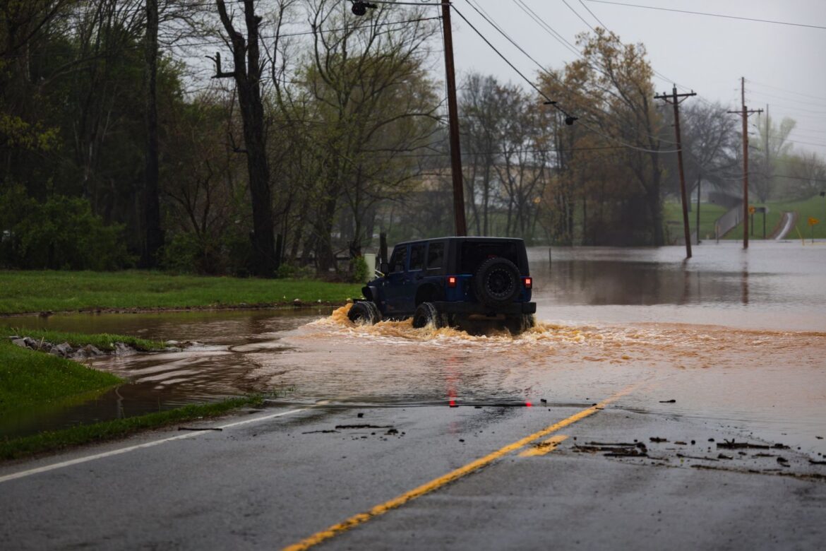 Vehicle navigating flooded road