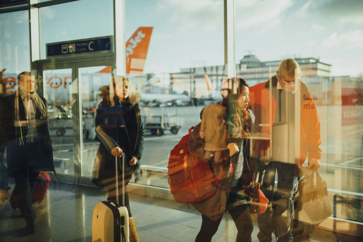 Travelers arriving at an airport terminal