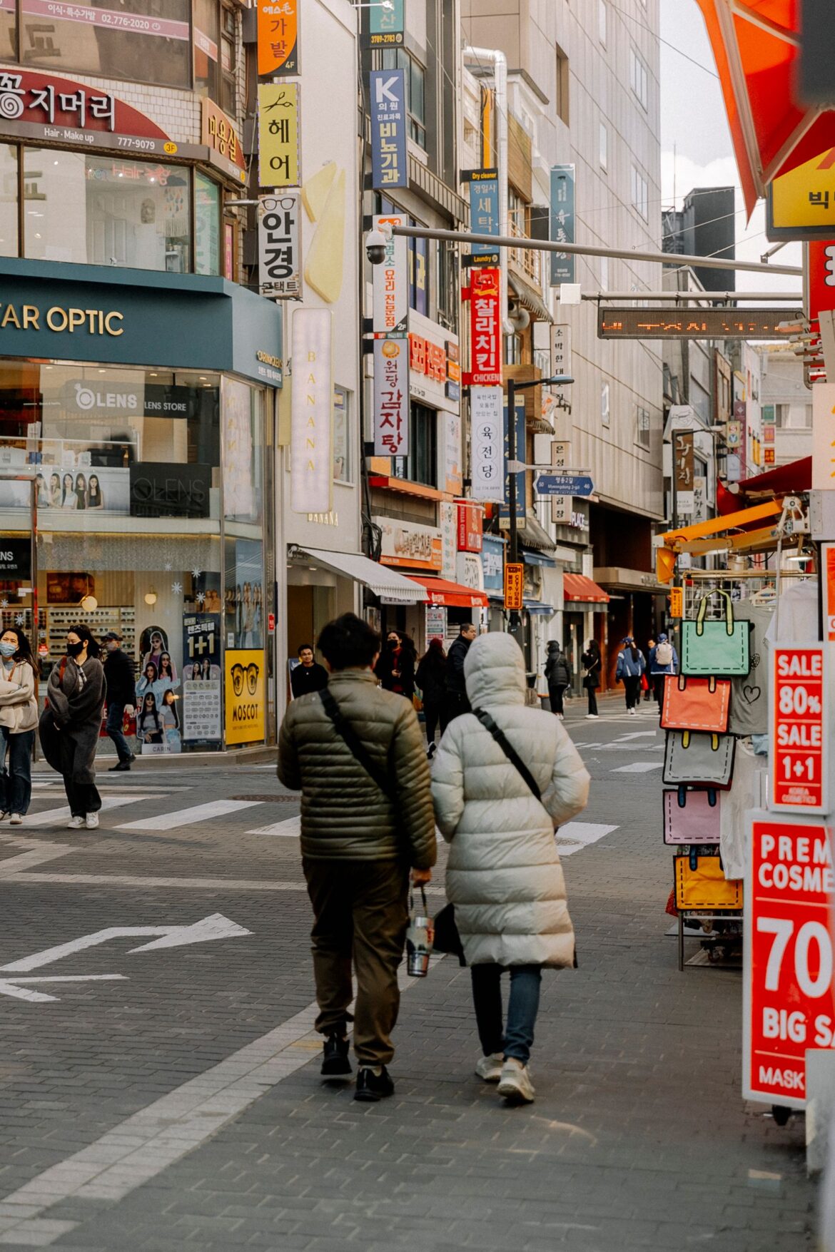 Tourists walking on a street in an Asian city