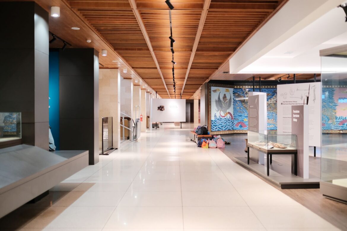 A spacious modern museum interior with exhibits