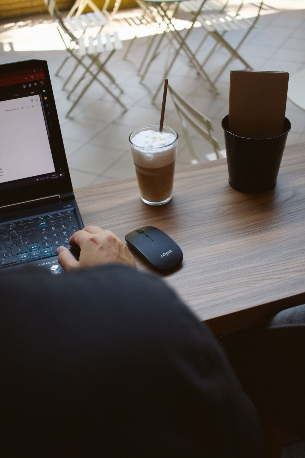 A writer working with a laptop and coffee