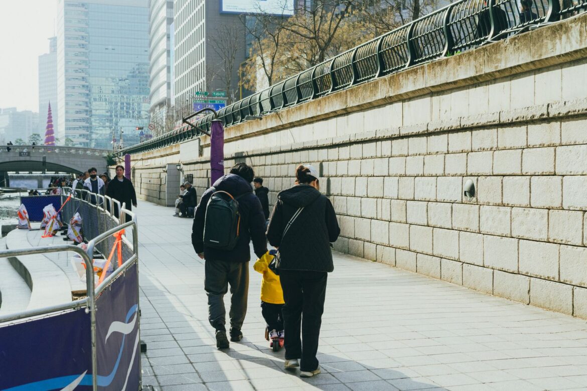 Family strolling in Seoul, representing South Korea birth rate and family life trends