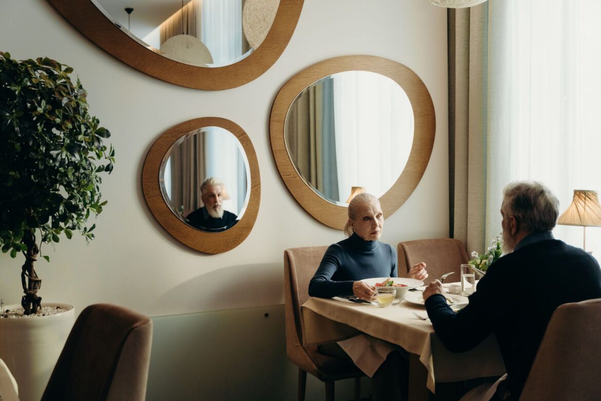Senior couple at a restaurant table, representing Korea 50s-60s matchmaking dating culture
