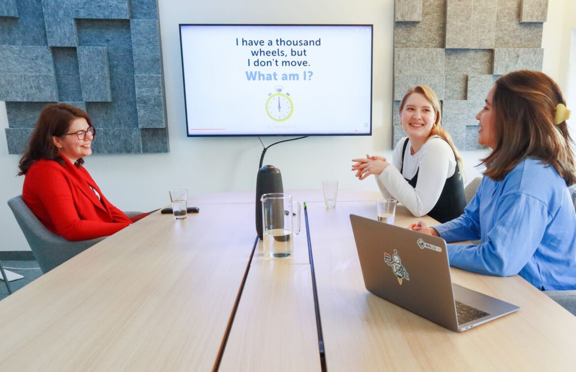 People at a panel discussion table