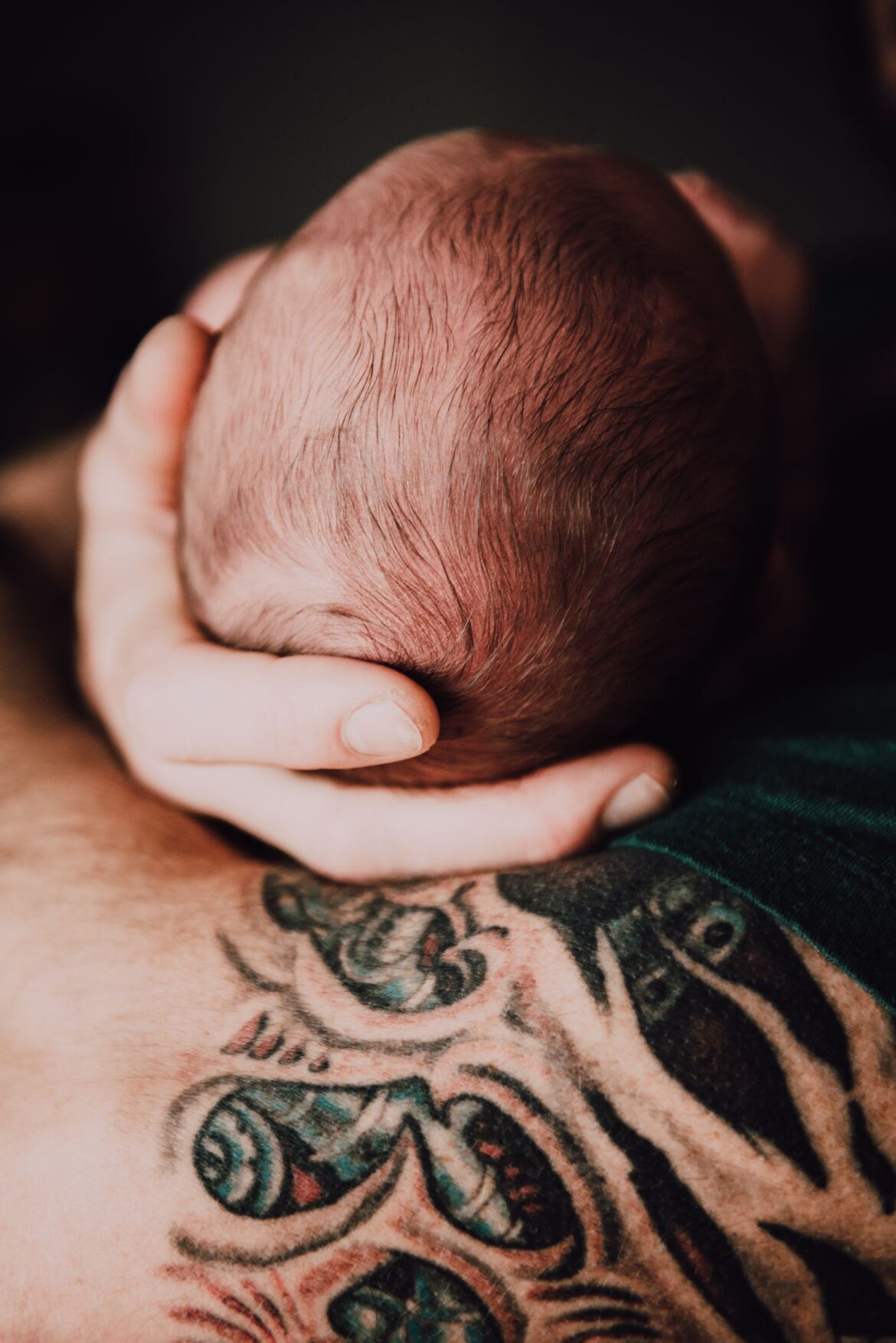 A newborn baby with family
