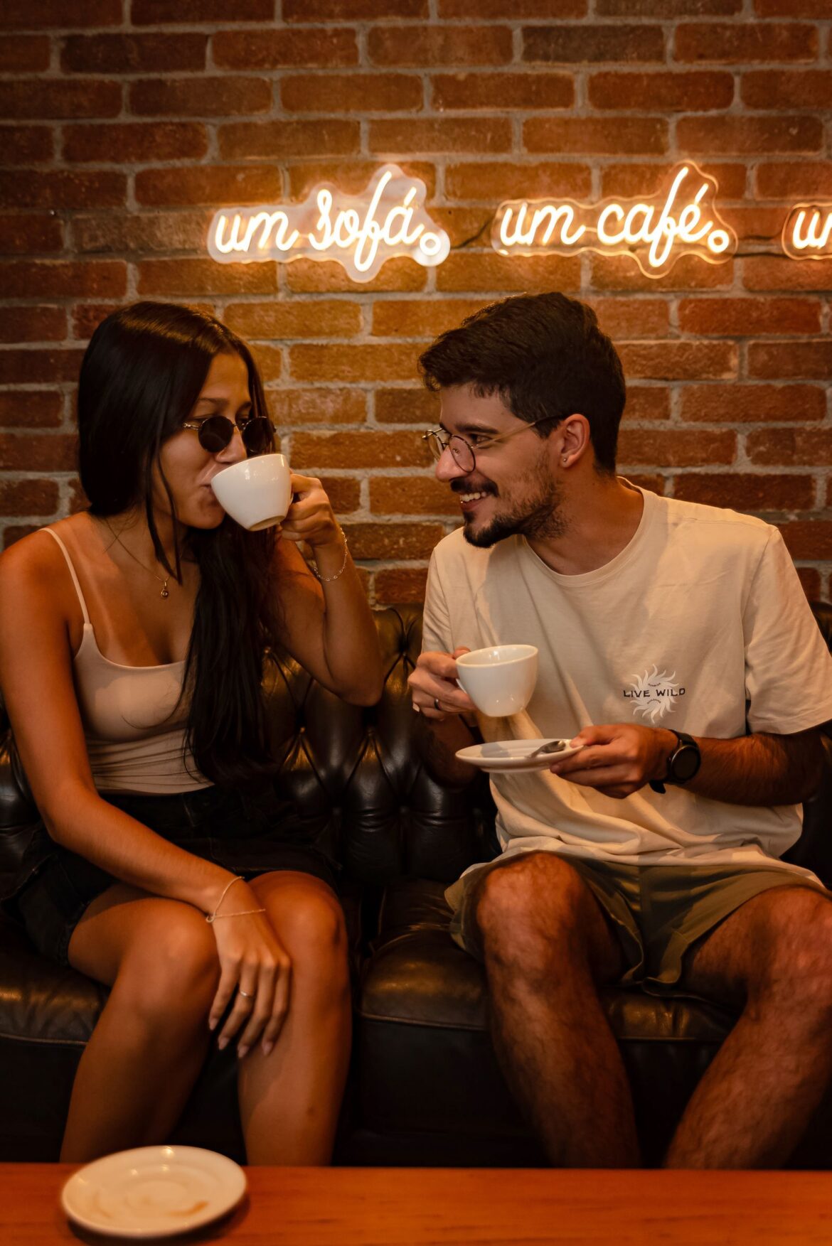 A young couple talking over coffee