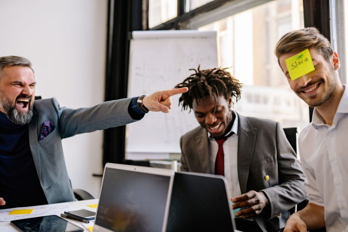 Office colleagues laughing together
