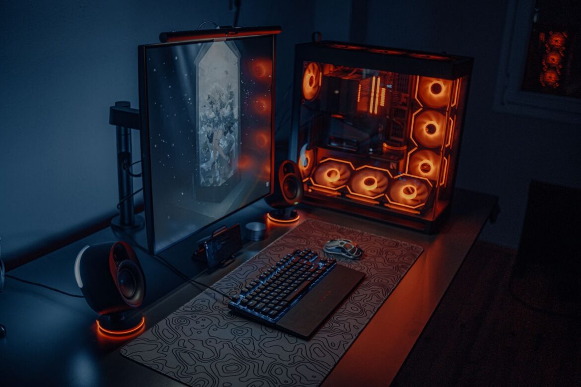 A modern gaming desk setup with RGB lighting