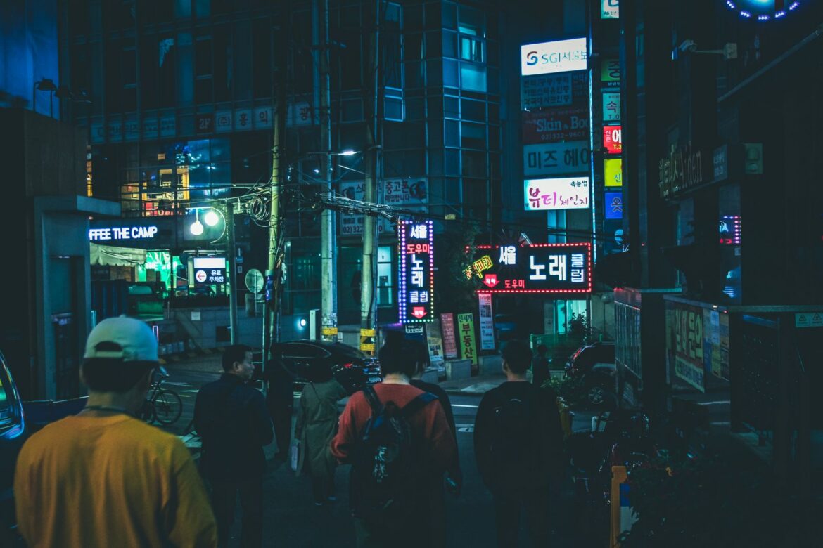Lively Seoul street at night with neon lights