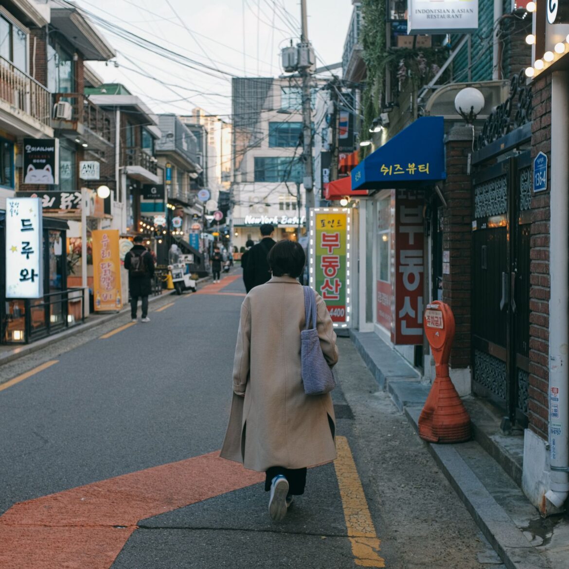 Vibrant street life in a bustling shopping area of Seoul South Korea filled with shops and pedestrians