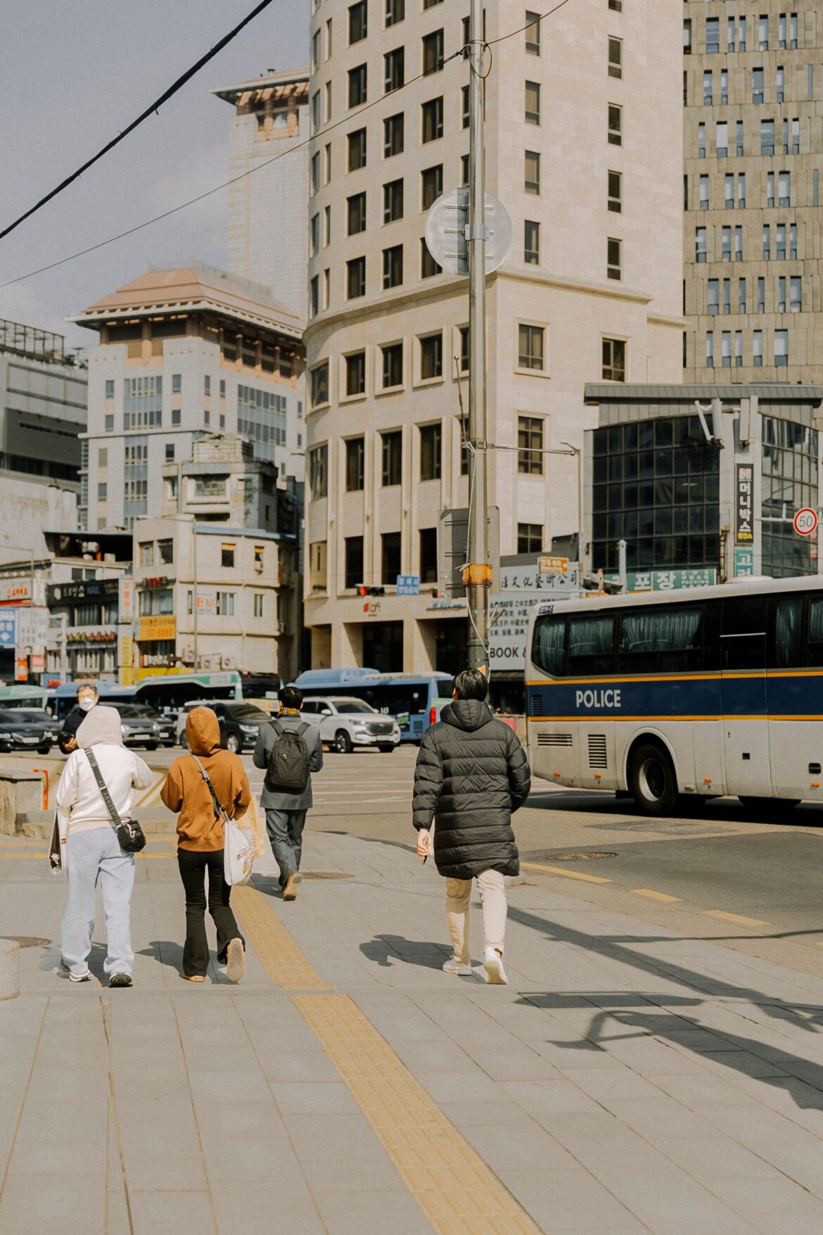 People walking on urban street in Seoul