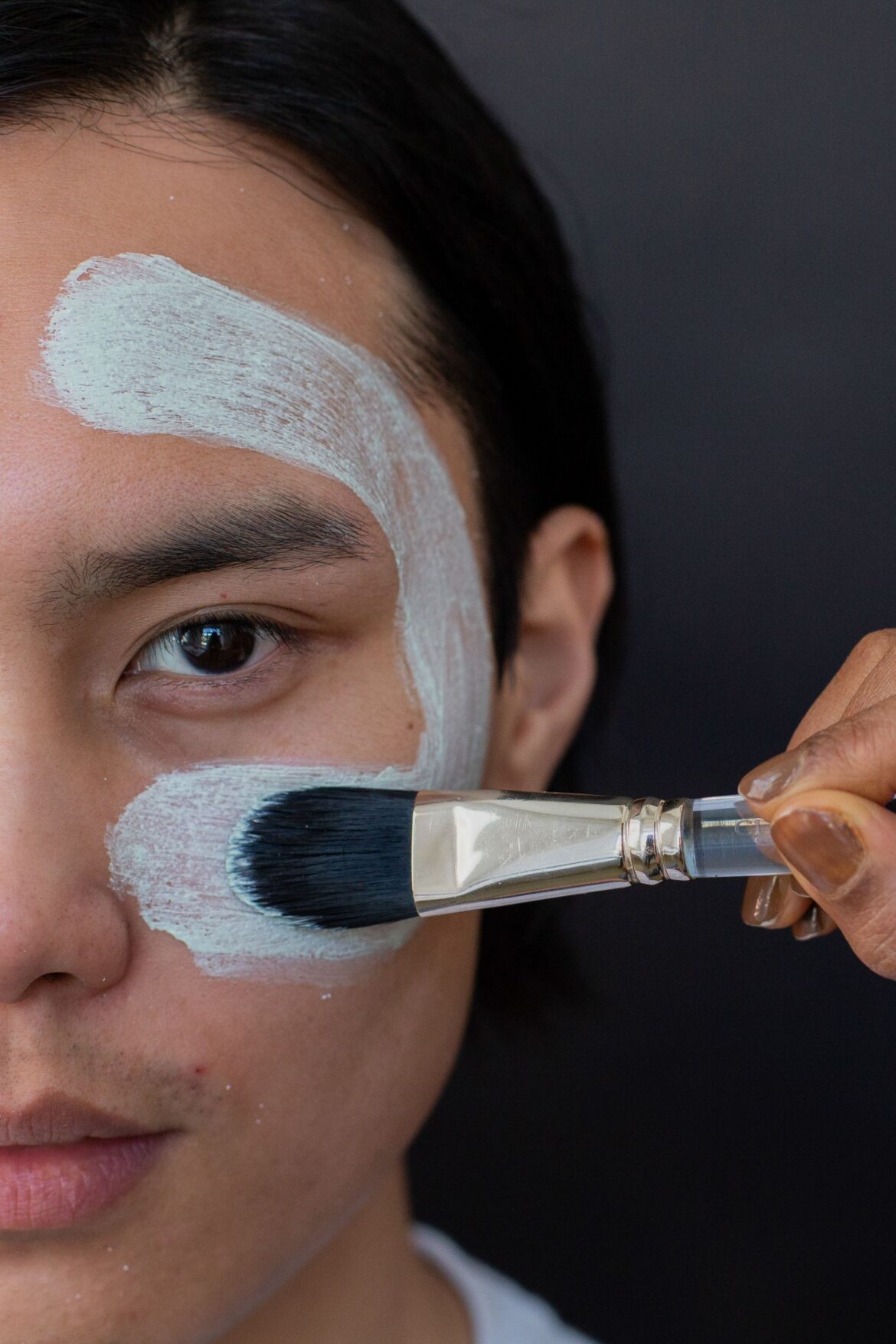 A person applying a skincare product