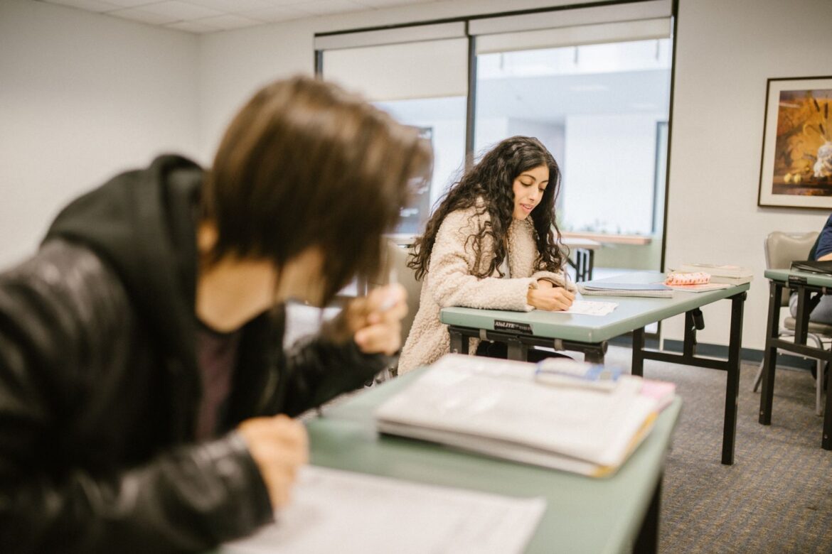 Students writing in classroom