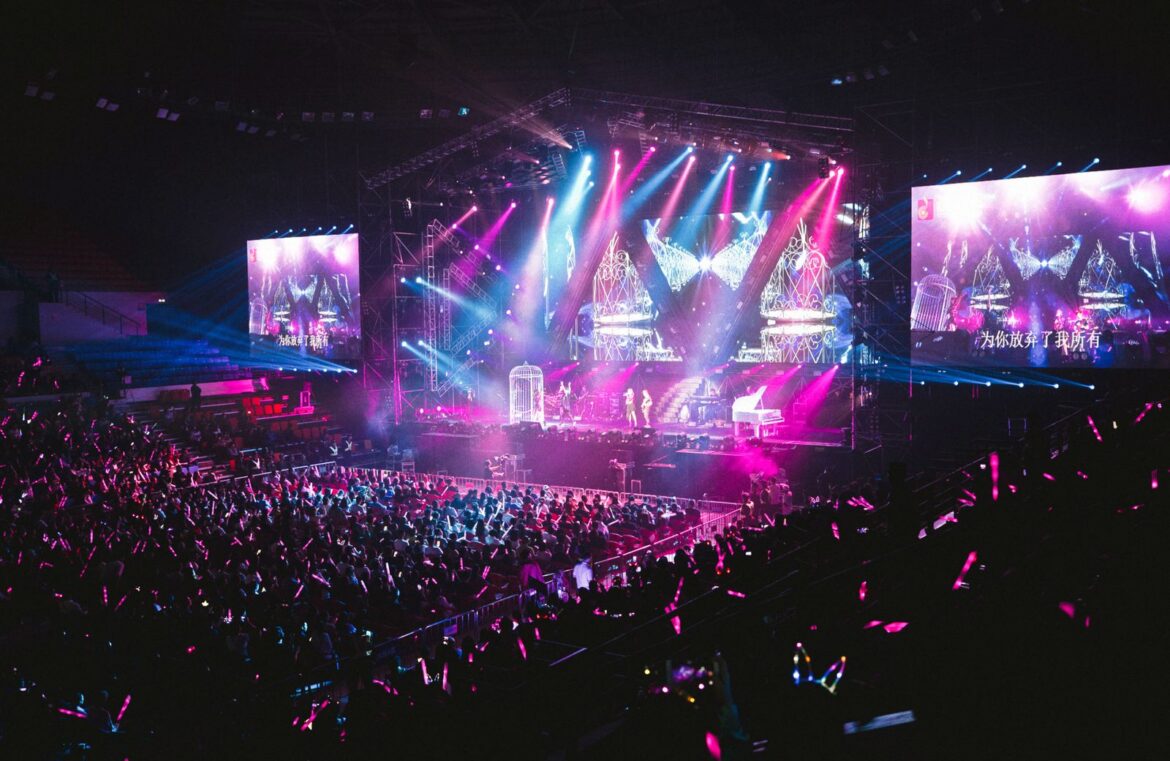An arena stage with dramatic lighting
